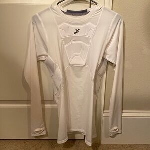 White long sleeve Storelli compression shirt with sternum and rib protectors